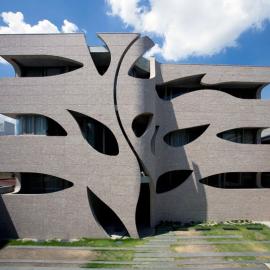 EASTERN design office carves nature influenced holes out of villa saitan in japa